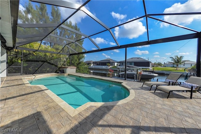 view of pool featuring a patio and glass enclosure