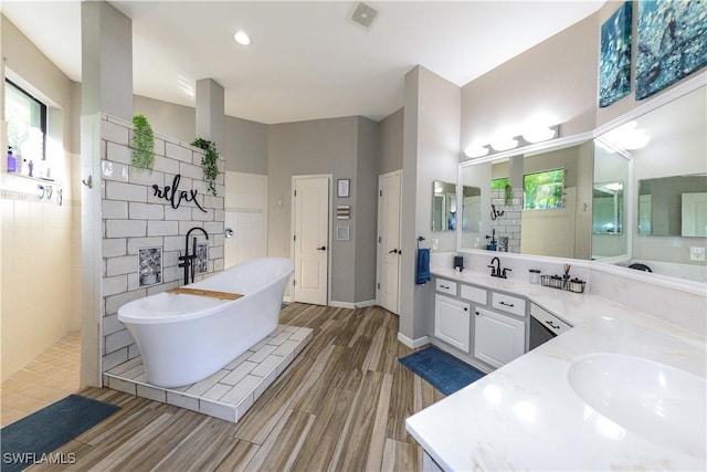 bathroom featuring hardwood / wood-style flooring, vanity, shower with separate bathtub, and a healthy amount of sunlight