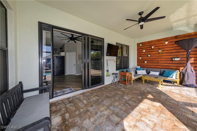 view of patio / terrace with an outdoor living space and ceiling fan