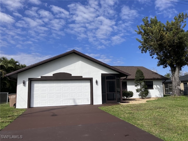 ranch-style house featuring an attached garage, a front yard, concrete driveway, and stucco siding