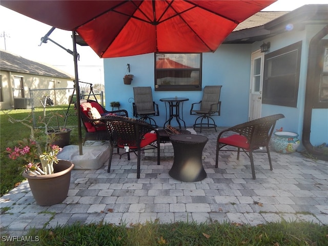 view of patio with central AC