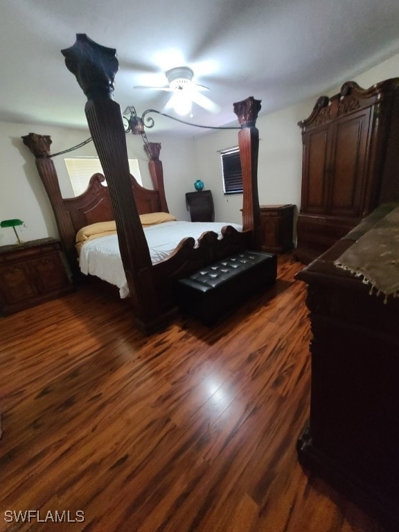 bedroom featuring dark wood-style flooring