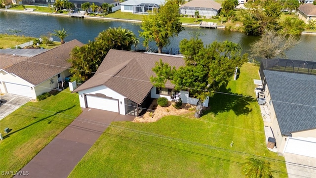 bird's eye view with a water view and a residential view