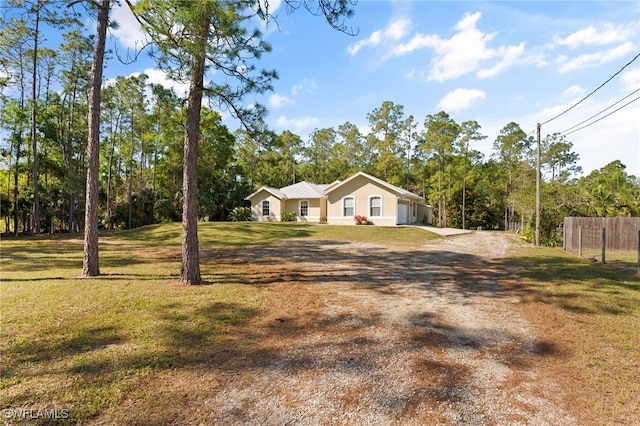 single story home with a front yard