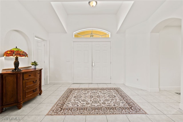 foyer featuring light tile patterned floors