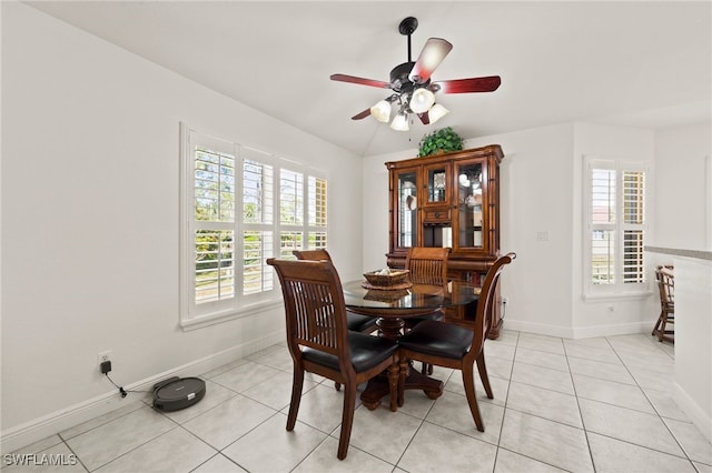 tiled dining room with ceiling fan