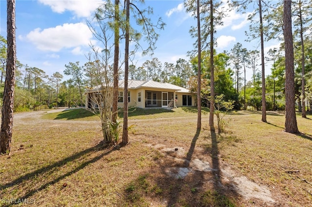 view of yard featuring a sunroom