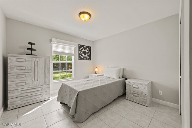 bedroom featuring light tile patterned floors