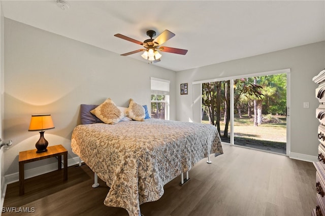 bedroom with dark hardwood / wood-style flooring, access to outside, and ceiling fan