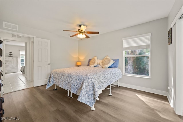 bedroom featuring wood-type flooring and ceiling fan