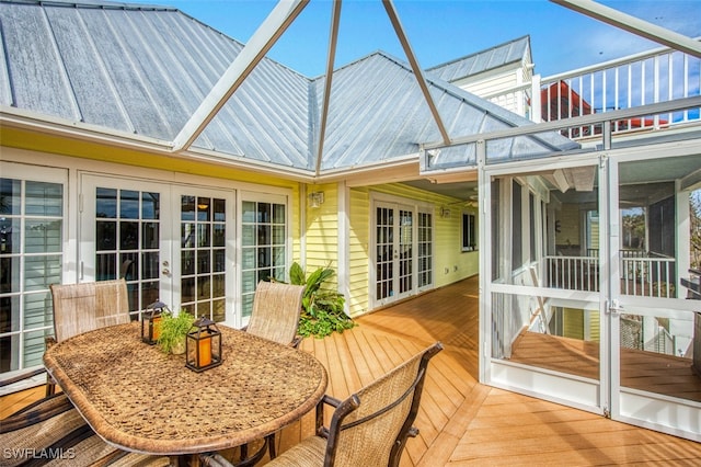 sunroom featuring french doors