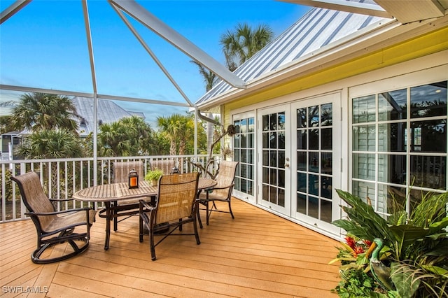 sunroom featuring vaulted ceiling