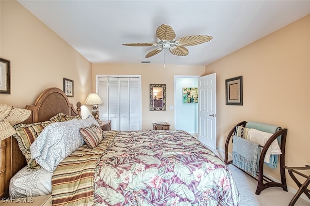 carpeted bedroom with a closet and ceiling fan