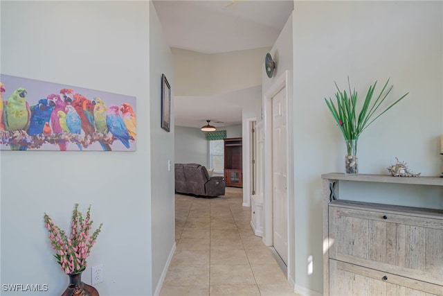 hall featuring light tile patterned floors