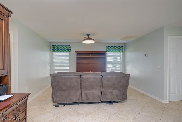 living room with light tile patterned flooring