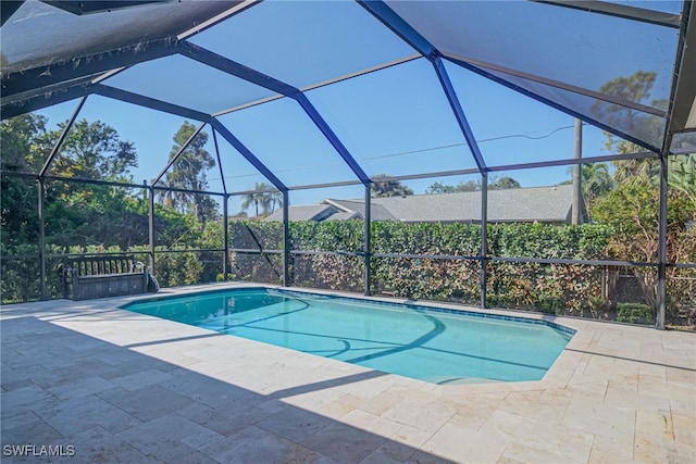 view of pool featuring a lanai and a patio