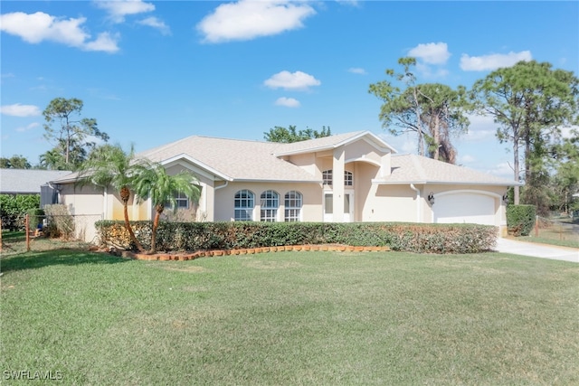 view of front of house featuring a garage and a front yard