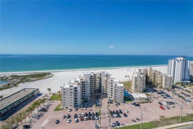 drone / aerial view featuring a view of the beach and a water view