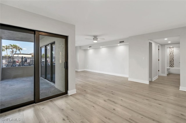 unfurnished room featuring ceiling fan and light hardwood / wood-style flooring