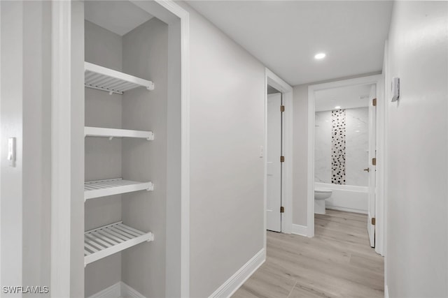 corridor featuring light hardwood / wood-style flooring