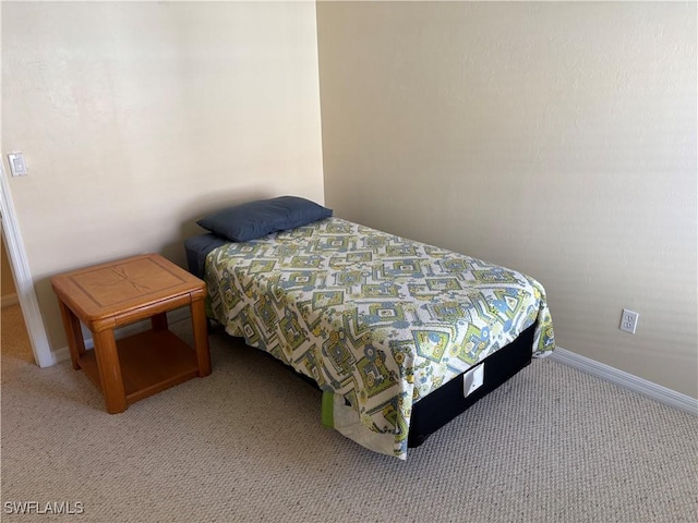 bedroom featuring light colored carpet