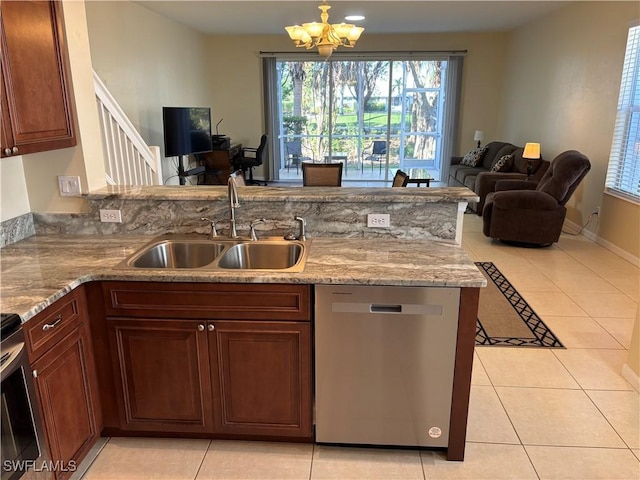 kitchen featuring an inviting chandelier, sink, stainless steel appliances, and light tile patterned flooring