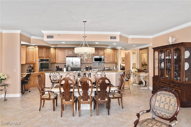 dining room featuring crown molding