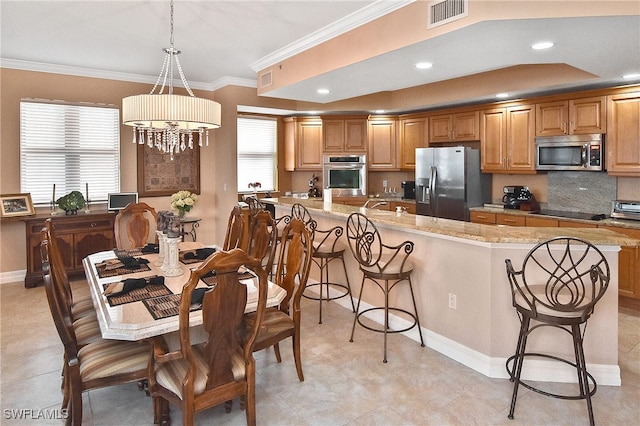 dining area with crown molding