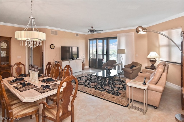 dining area featuring ceiling fan and ornamental molding