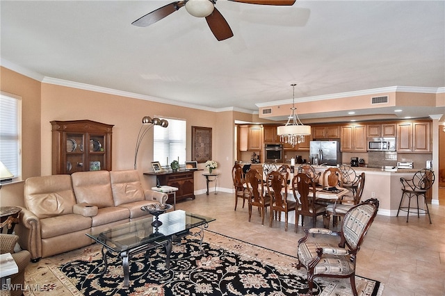 tiled living room featuring ceiling fan and ornamental molding