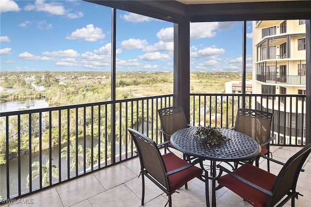 balcony featuring a water view