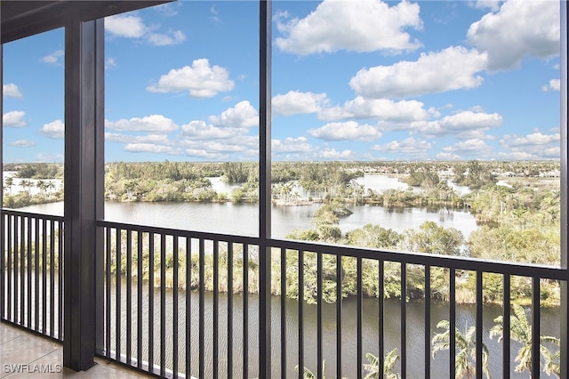 unfurnished sunroom with a water view