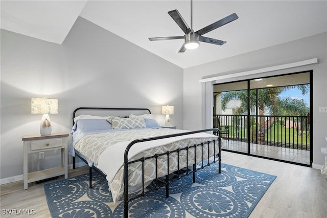 bedroom with hardwood / wood-style flooring, lofted ceiling, access to exterior, and ceiling fan