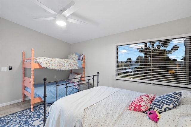 bedroom with hardwood / wood-style flooring and ceiling fan