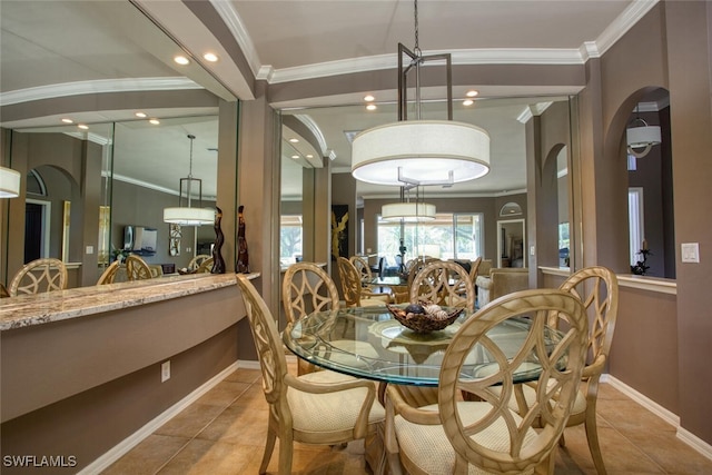 dining area featuring light tile patterned floors and ornamental molding