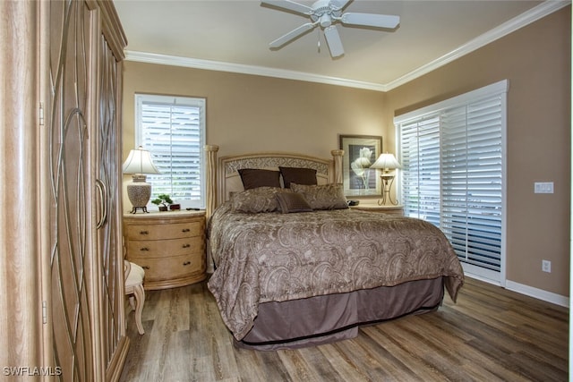 bedroom with wood-type flooring, ornamental molding, and ceiling fan