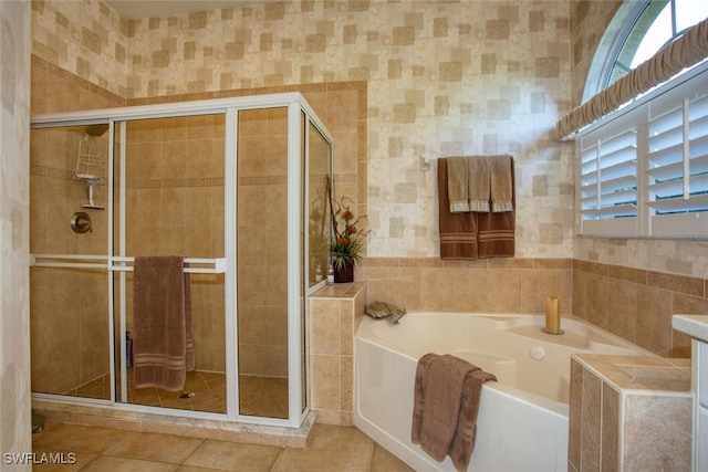 bathroom featuring tile patterned floors and shower with separate bathtub