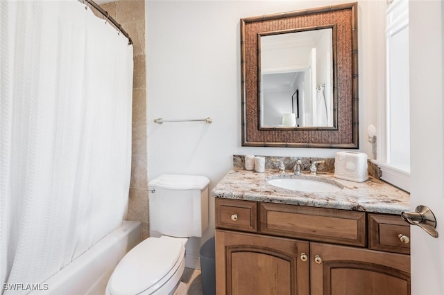 full bathroom featuring vanity, shower / bath combo, and toilet