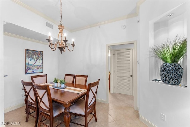 dining room with light tile patterned floors, ornamental molding, and a chandelier