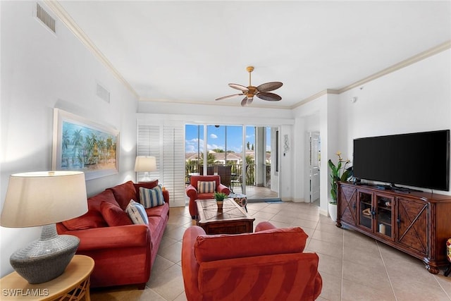 living room with crown molding, ceiling fan, and light tile patterned floors