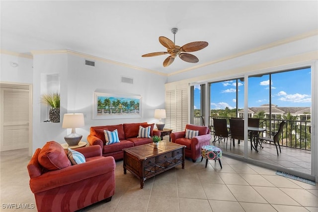 living room featuring crown molding, ceiling fan, and light tile patterned flooring