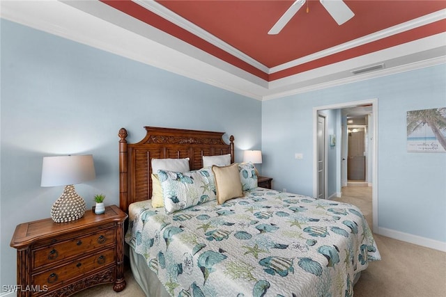 carpeted bedroom featuring ornamental molding and ceiling fan