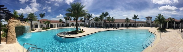 view of swimming pool featuring a patio and pool water feature