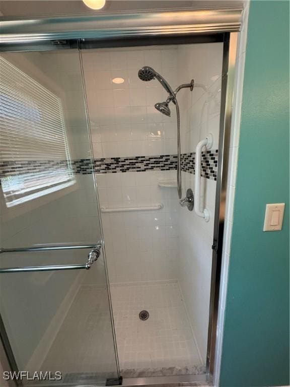 full bathroom featuring a shower stall