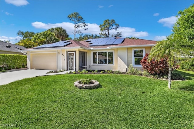 ranch-style house with driveway, solar panels, an attached garage, a front lawn, and stucco siding