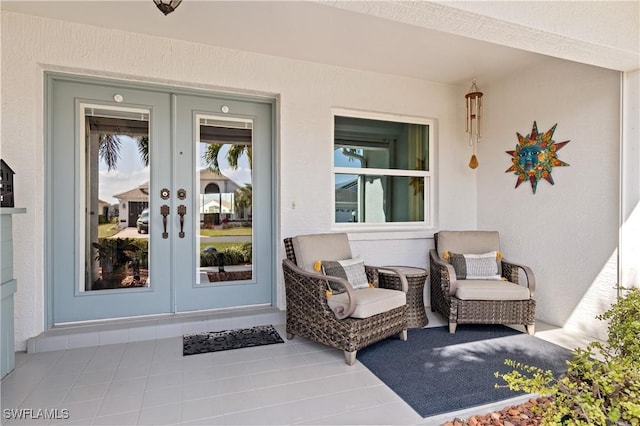 entrance to property featuring french doors