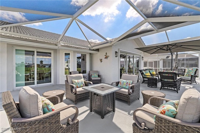 view of patio featuring an outdoor living space and glass enclosure