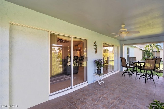 sunroom featuring plenty of natural light and ceiling fan