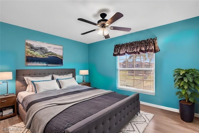 bedroom featuring hardwood / wood-style flooring and ceiling fan