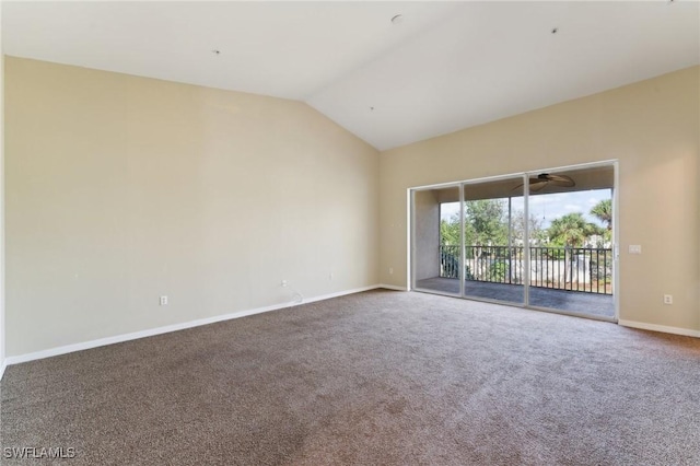 carpeted spare room featuring lofted ceiling